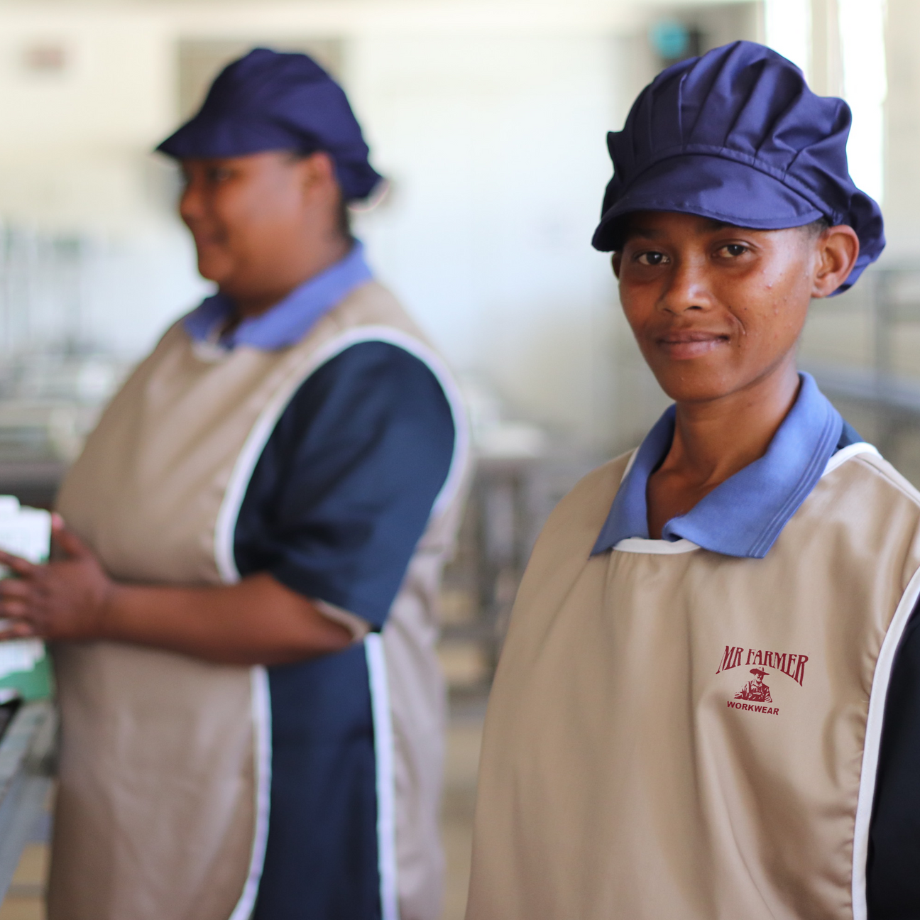 MRF Pack House image with 2 ladies food caps and tabard