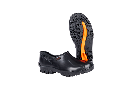Black PVC safety overshoe with slip-resistant sole and orange tread, displayed on a white background.
