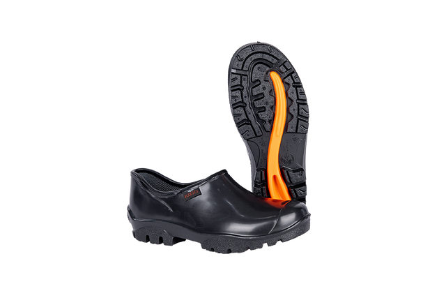 Black PVC safety overshoe with slip-resistant sole and orange tread, displayed on a white background.